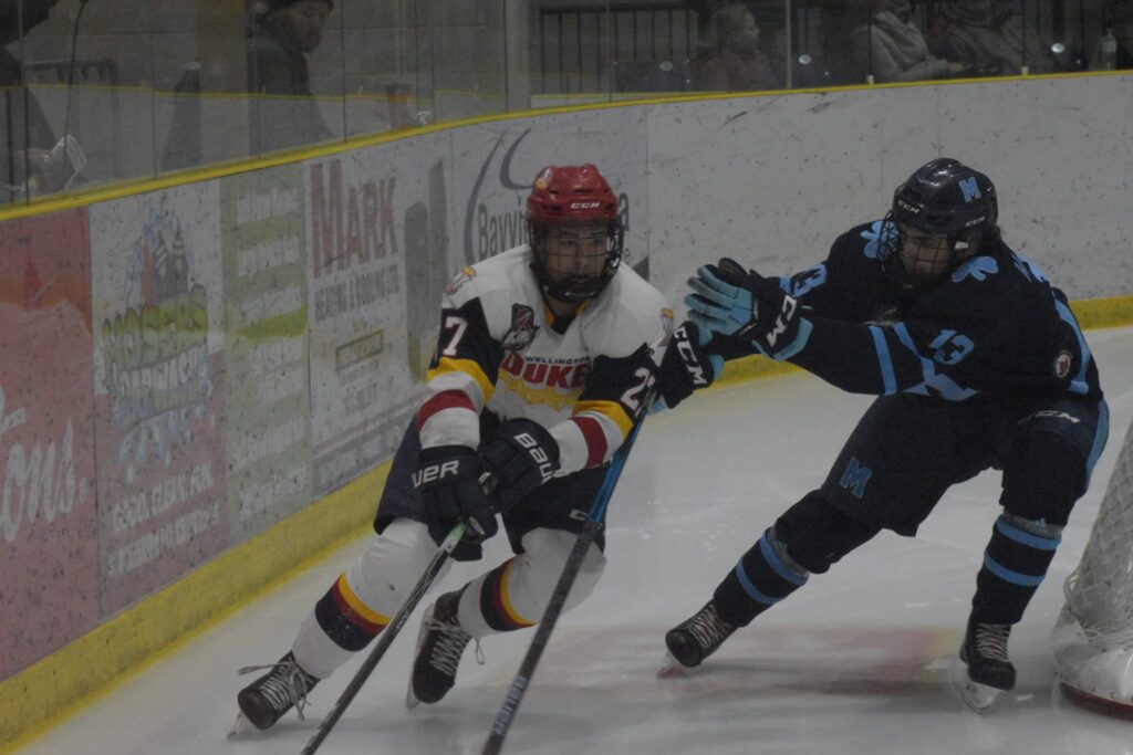<p>BUZZED- Wellington Duke EIjah Gonsalves escapes the clutches of St. Mike’s Buzzers forward Ryan Alexander during Wellington’s 3-2 win at Lehigh Arena Friday evening. (Jason Parks/Gazette Staff) </p>
