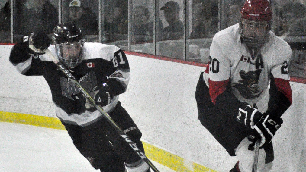 <p>Pirates defenceman Matthew Scott tries to evade Keegan Wayte during Picton&#8217;s 5-4 overtime win against Napanee on Thursday.<br />
(Adam Bramburger/Gazette Staff)</p>
