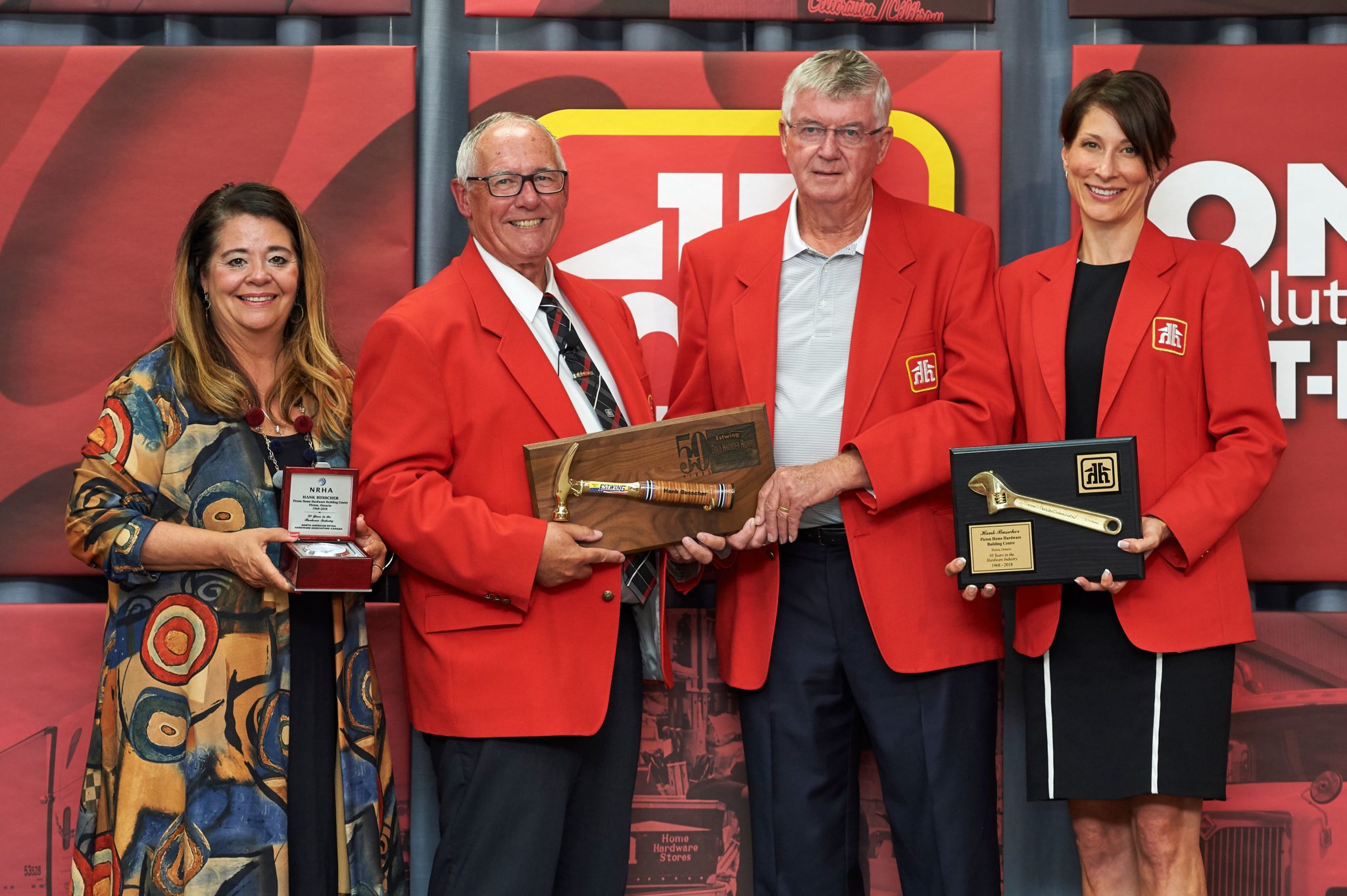 <p>Celebrating 50 years -Hank Busscher, second from right, receives the North American Retail Hardware Association’s Golden Hammer from (from left) NRHA representative Marci Taschler, retired Home Hardware chief executive officer Terry Davis, and Home Hardware dealer support director Sherri Amos. (Submitted photo)</p>
