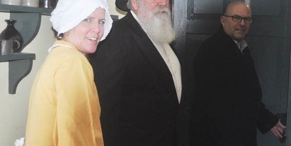 <p>Solving a puzzle -Joined by Jane (Suzanne O’Connor) and Rev. William Macaulay (Ed Van Bruinessen), the latter making a rare special appearance,  Mayor Steve Ferguson enters the escape room in Macaulay House. Will he make it out on time? (Adam Bramburger/Gazette staff)</p>
