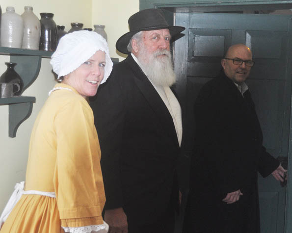 <p>Solving a puzzle -Joined by Jane (Suzanne O’Connor) and Rev. William Macaulay (Ed Van Bruinessen), the latter making a rare special appearance,  Mayor Steve Ferguson enters the escape room in Macaulay House. Will he make it out on time? (Adam Bramburger/Gazette staff)</p>
