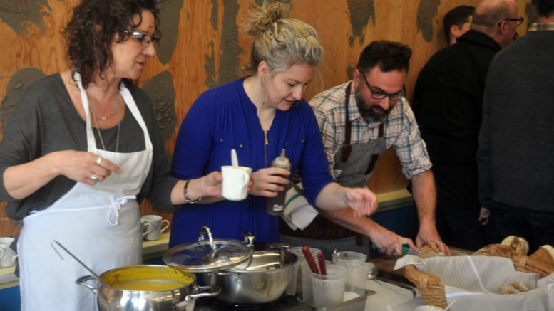 <p>Making meals  – County Food Hub board members Sacha Squair, Melissa Tran and Albert Ponzo dish out Ponzo’s locally grown squash soup with garnishes during a recent groundbreaking ceremony. (Adam Bramburger/Gazette file photo)</p>
