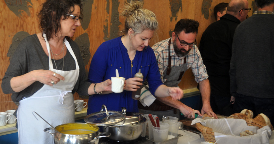<p>Making meals  – County Food Hub board members Sacha Squair, Melissa Tran and Albert Ponzo dish out Ponzo’s locally grown squash soup with garnishes during a recent groundbreaking ceremony. (Adam Bramburger/Gazette file photo)</p>
