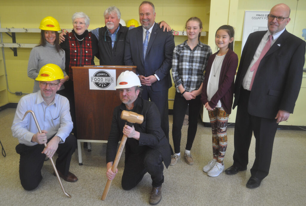 <p>A new beginning -County Food Hub co-chairs Todd Foster and Mike Farrell (foreground) join, from left: Hastings and Prince Edward District School Board chair Shannon Binder, supporter Libby Crombie, Sophiasburgh councillor Bill Roberts, Minister of Economic Development, Job Creation and Trade Todd Smith, Sophiasburgh students Bethany Foster and Alison Tran and Mayor Steve Ferguson at Friday’s ceremonial groundbreaking. (Adam Bramburger/Gazette staff)</p>
