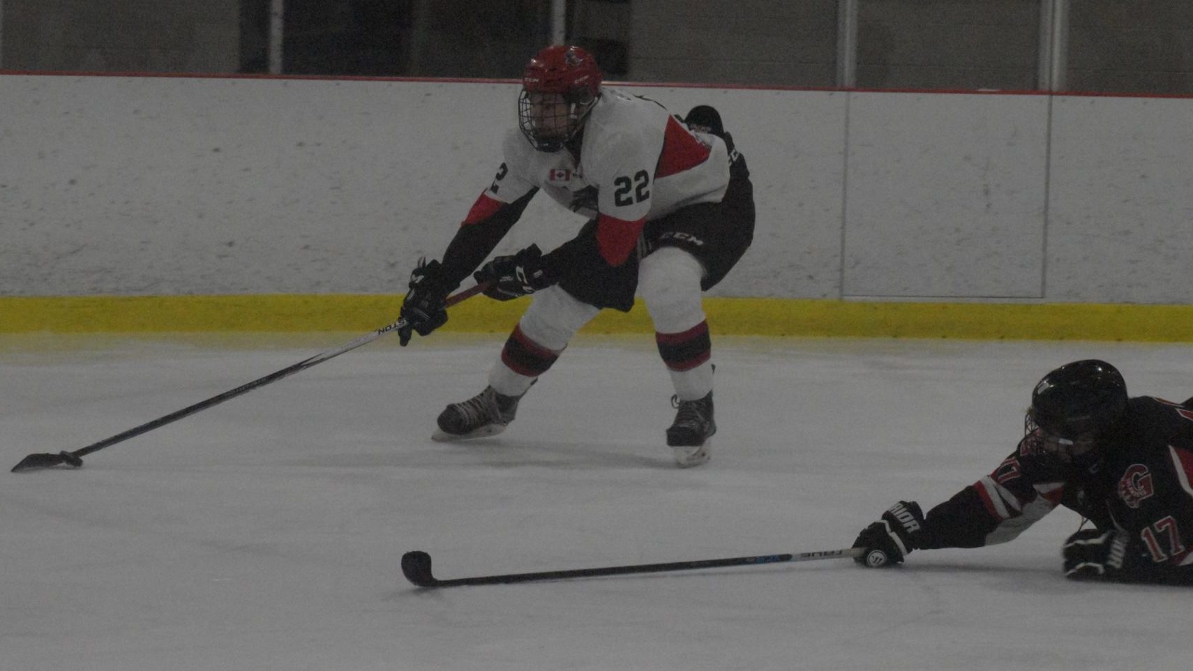 <p>ISLANDERS IN THE WAKE-  Picton’s Nate Boomhower skates past a diving Ross Campbell in the Pirates 3-1 win over visiting Gananoque on Thursday evening (Jason Parks/Gazette Staff)</p>
