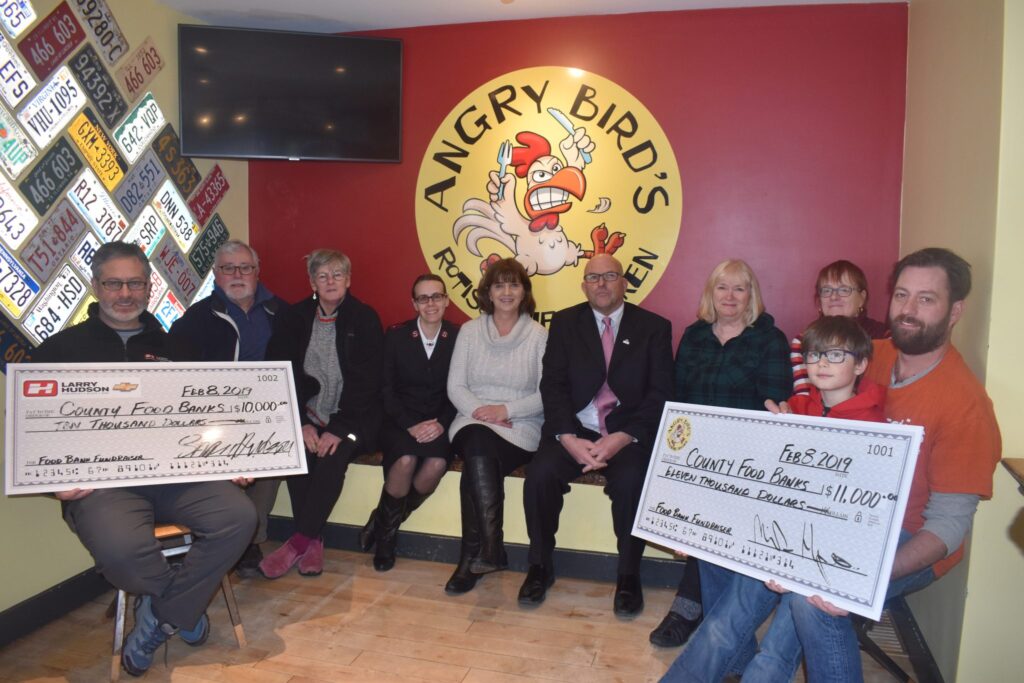 <p>A COMBO EFFORT- Thanks to Angry Birds Rotisserie Chicken Restaurant and Larry Hudson Chevrolet Buick GMC of Listowel, ON, a trio of local food banks have had $7,000 each added to their coffers. Pictured at Friday’s cheque presentation are (From Left) Bill Heffernan of Larry Hudson Chevrolet, Mick Chalmers and Sue Hyatt of the Picton United Church County Food Bank, Lieutenant Donna Ludlow of the Picton branch of the Salvation Army, Storehouse Food Bank’s Linda Downey, County of Prince Edward Mayor Steve Ferguson, Trudy Greer and Tanis Crowe of the Picton United Church County Food Bank, and Michael Hymus and Channing Comeau-Hymus of Hymus Holdings/Angry Birds. (Jason Parks/Gazette Staff)</p>

