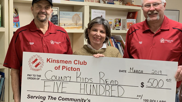 <p>Kinsmen Club of Picton vice-president Terry Miller, left, and treasurer Phil St. Jean present County Kids Read co-ordinator Anne Preston a $500 donation to support the children’s literacy program. (Submitted photo)</p>
