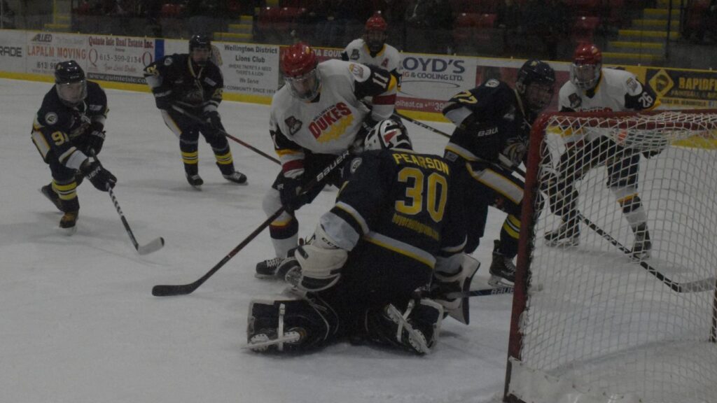 <p>LOOSE PUCKS- The puck slips between Whitby Fury goaltender Luke Pearson’s pads as Wellington Duke forward Frank Vitucci hunts for a rebound during the second period of Game 2 of the Ontario Junior Hockey League’s 2019 Eastern Divison finals. Wellington was unable to capitalize on this and many other chances, falling to the visiting Fury 3-1. (Jason Parks/Gazette Staff)</p>
