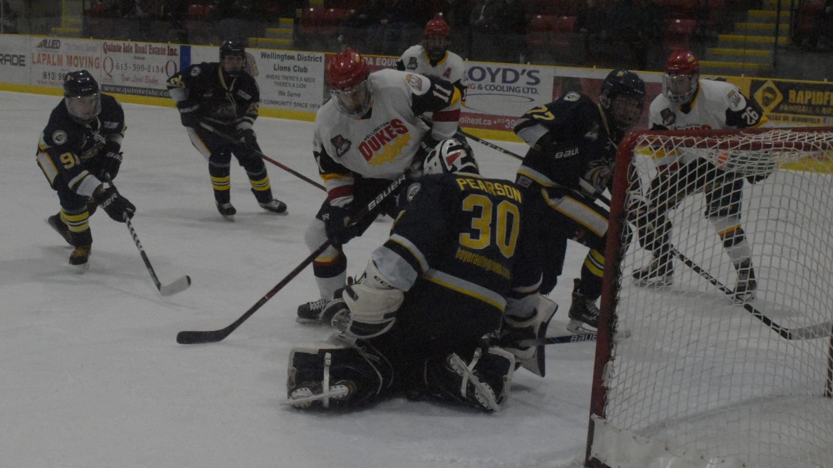 <p>LOOSE PUCKS- The puck slips between Whitby Fury goaltender Luke Pearson’s pads as Wellington Duke forward Frank Vitucci hunts for a rebound during the second period of Game 2 of the Ontario Junior Hockey League’s 2019 Eastern Divison finals. Wellington was unable to capitalize on this and many other chances, falling to the visiting Fury 3-1. (Jason Parks/Gazette Staff)</p>
