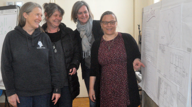 <p>New digs – From left, Alternatives for Women board members Dee Hazell, Caroline Granger, and Emily Cowan look on as executive director Rahno Boutilier shows them details in the drawings for Vi’s Place, the agency’s new home, which will also provide three transitional housing units, a rent-geared-to-income apartment, and a shelter room. (Adam Bramburger/Gazette staff)</p>
