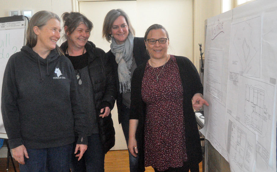 <p>New digs – From left, Alternatives for Women board members Dee Hazell, Caroline Granger, and Emily Cowan look on as executive director Rahno Boutilier shows them details in the drawings for Vi’s Place, the agency’s new home, which will also provide three transitional housing units, a rent-geared-to-income apartment, and a shelter room. (Adam Bramburger/Gazette staff)</p>
