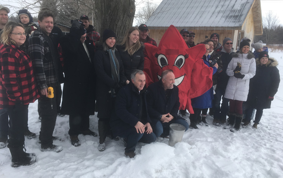 <p>A sweet  Scene Prince Edward County maple syrup producers and dignitaries pose for photos with Mabel the Maple Leaf Friday at Loha Farms to promote the 18th Maple in the County weekend March 30-31 There are 13 sugar bushes participating with a wide range of family activities. (Adam Bramburger/Gazette staff)</p>
