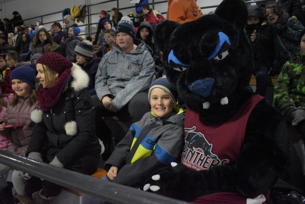 <p>Brady Terpstra has a great time cheering with the PECI Panther at the annual school staff-student hockey game at Huff Estates Arena on Thursday. (Jason Parks/Gazette Staff)</p>
