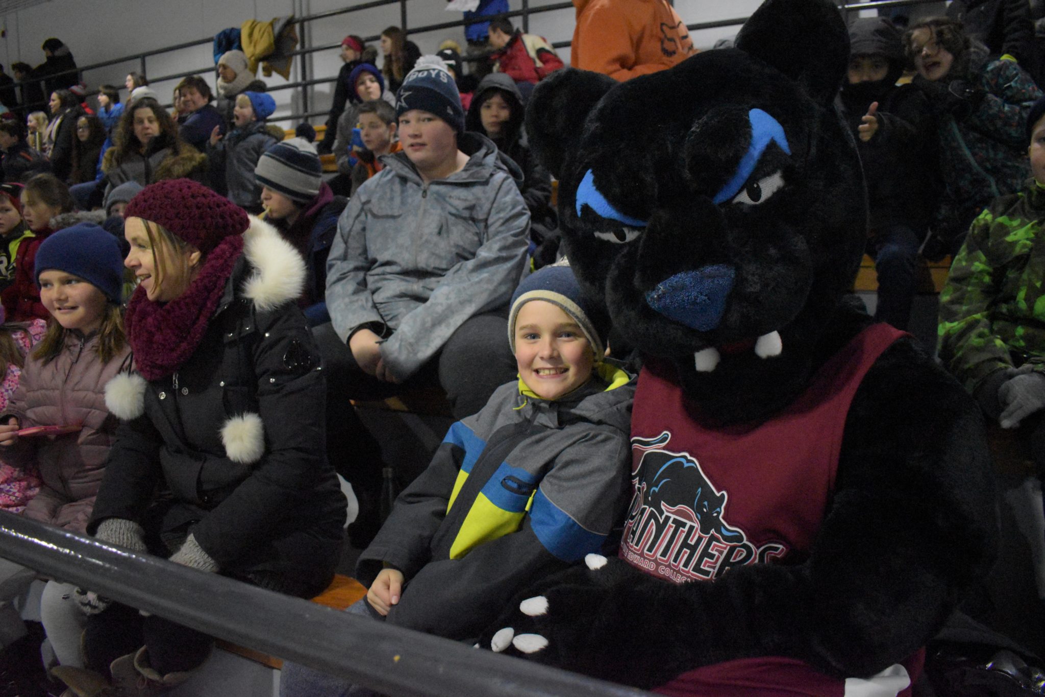 <p>Brady Terpstra has a great time cheering with the PECI Panther at the annual school staff-student hockey game at Huff Estates Arena on Thursday. (Jason Parks/Gazette Staff)</p>
