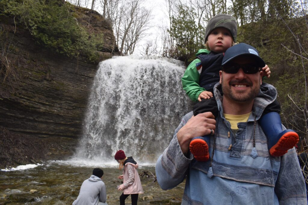 <p>WASHED AWAY  Gavin Cordes and his father Ron at the 2019 Rotary Club of Picton Waterfall tour at Jackson’s falls. The club was forced to cancel its annual tour as well as the May  lilac cycling tour.(Jason Parks/Gazette Staff)</p>
