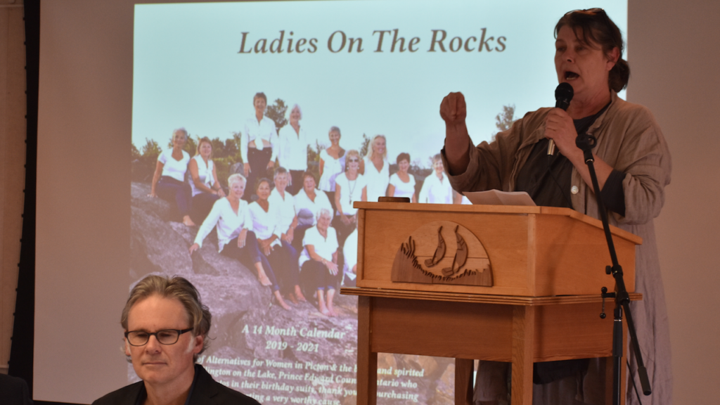 <p>THE LADIES WHO ROCK- With Wellington councillor Mike Harper listening on, Alternatives for Women Chair Caroline Granger speaks to the efforts of a group of women from Wellington-on-the-Lake who bared all in a fundraising calendar that will support the local battered and abused women’s advocacy group. (Jason Parks/Gazette Staff)</p>
