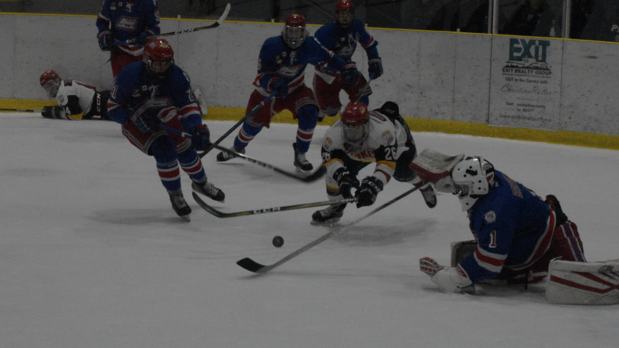 <p>LAYING IT ON THE LINE- Wellington Duke Ben Woodhouse and Oakville netminder Will Barber go horizontal for a puck during the first period the Blades 4-3 win over the Dukes in Game 2 of the 2019 Buckland Cup finals Sunday night at Lehigh Arena. (Jason Parks/Gazette Staff)</p>
