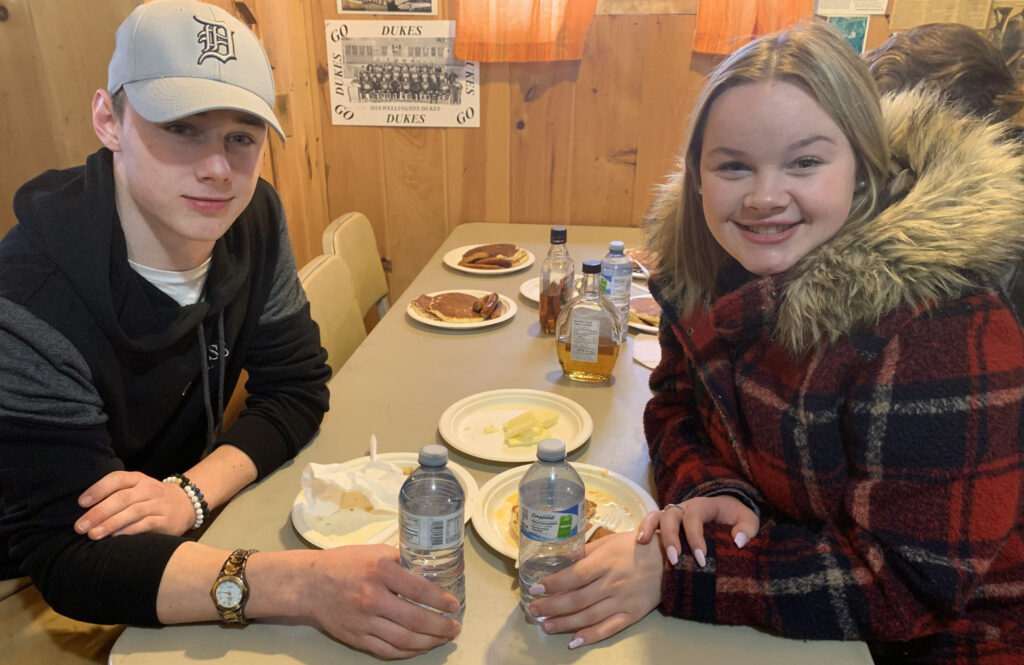 <p>Spring custom – Zack Empey and Cody-Rae Fowler visit Fosterholm Farms year after year for its pancake breakfast at Maple in the County. (Adam Bramburger/Gazette staff)</p>

