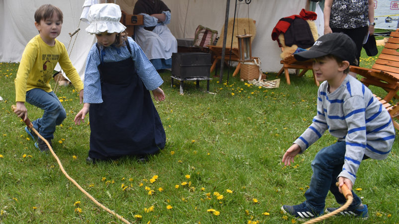 <p>CHILDREN AT PLAY-  Evelyn Adams of Cornwall plays a game with (left) Benton and Wellington Mains of Kitchener at the Gathering of Friends event this weekend. (Jason Parks/Gazette Staff)</p>

