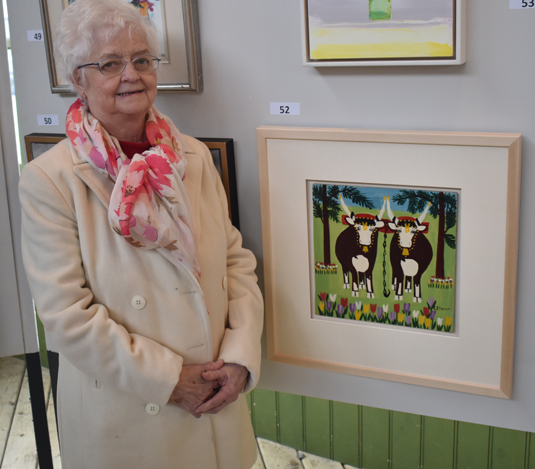 <p>THAT’S MAUDE – Gerry Russel, great niece of native Nova Scotian artist Maude Lewis was in attendance at the Bid the Build event Saturday. Russel is shown with Oxen in Spring. (Sarah Williams/Gazette Staff)</p>
