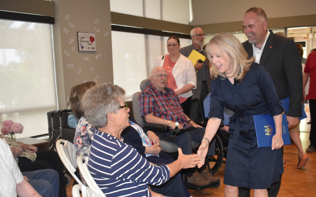 <p>A NEW DAY DAWNING AT HJ- Minister of Longterm Care Dr. Merrilee Fullerton and Bay of Quinte MPP Todd Smith greet residents at H.J. McFarland Home. The province announced it was allocating 76 new beds and investing in facility upgrades. (Jason Parks/Gazette Staff)</p>

