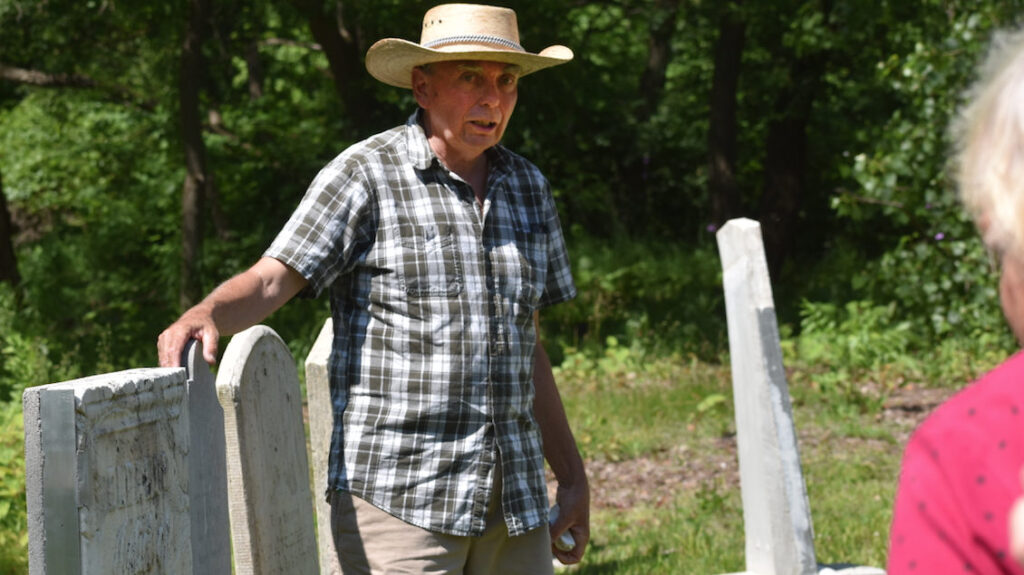 <p>SIFTING THROUGH THE SANDS OF TIME – Past President of Campbell Monuments, Gary Foster, speaks to a crowd on a guided walking tour of Glenwood Cemetery Sunday. (Sarah Williams/Gazette Staff)</p>
