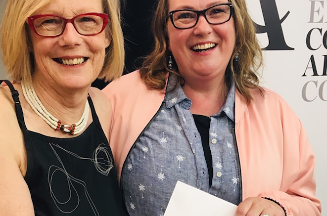 <p>THE ARTS ARE ILLUMINATED – (L-R) AITC board member Sarah Moran presents Krista Dalby with the Community Arts Builder Award at the 26th annual Art in the County opening night. (Facebook photo)</p>
