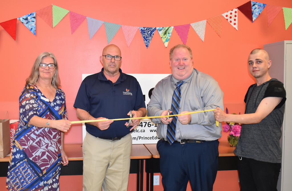 <p>CUTTING RIBBON INSTEAD OF TAPE – (L-R) Executive Director Kathy Kennedy, Mayor Steve Ferguson, MPP Todd Smith’s Constituency Assistant Adam Bramburger and PELC Student Nick Ryan cut the ceremonial ribbon at last Thursday’s AGM. (Sarah Williams/Gazette Staff)</p>
