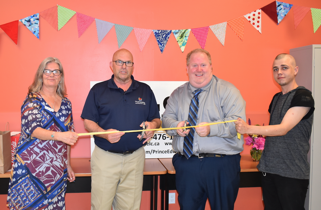 <p>CUTTING RIBBON INSTEAD OF TAPE – (L-R) Executive Director Kathy Kennedy, Mayor Steve Ferguson, MPP Todd Smith’s Constituency Assistant Adam Bramburger and PELC Student Nick Ryan cut the ceremonial ribbon at last Thursday’s AGM. (Sarah Williams/Gazette Staff)</p>
