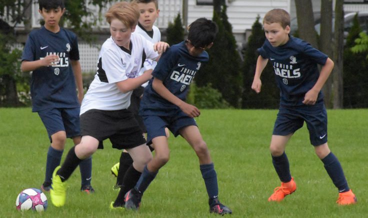 <p>TAKE OFF (In white) Alex Pickle and Hayden Bender of the Quinte Ortho U12 Eagles try to move the ball into scoring position against the Kingston Clippers in SOSA action in Picton Thursday.  (Jason Parks/Gazette Staff)</p>
