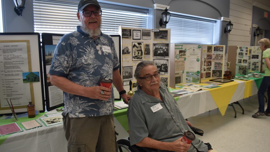 <p>LONG DISTANCE CALLER (Left) Moose Jaw, SK resident Bill Mitchell drove three days to help his friend Jim Lindle attend the Queen Elizabeth and Pinecrest Memorial School reunion  at the Prince Edward Community Centre on Saturday. (Jason Parks/Gazette Staff)</p>
