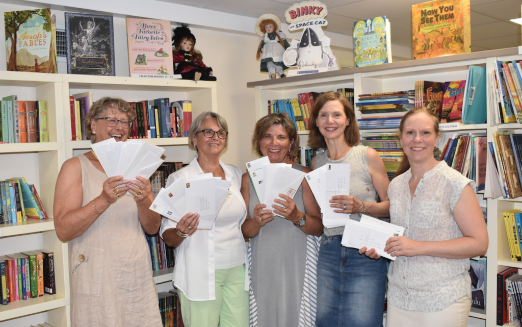 <p>A BOOK FOR EVERY CHILD – Members of County Kids Read (L-R)  Linda Mason, Sandy Norval, Anne Preston, Sarah Crawford and Janna Smith pose gleefully with the donation from 100 People Who Care. (Sarah Williams/Gazette Photo)</p>
