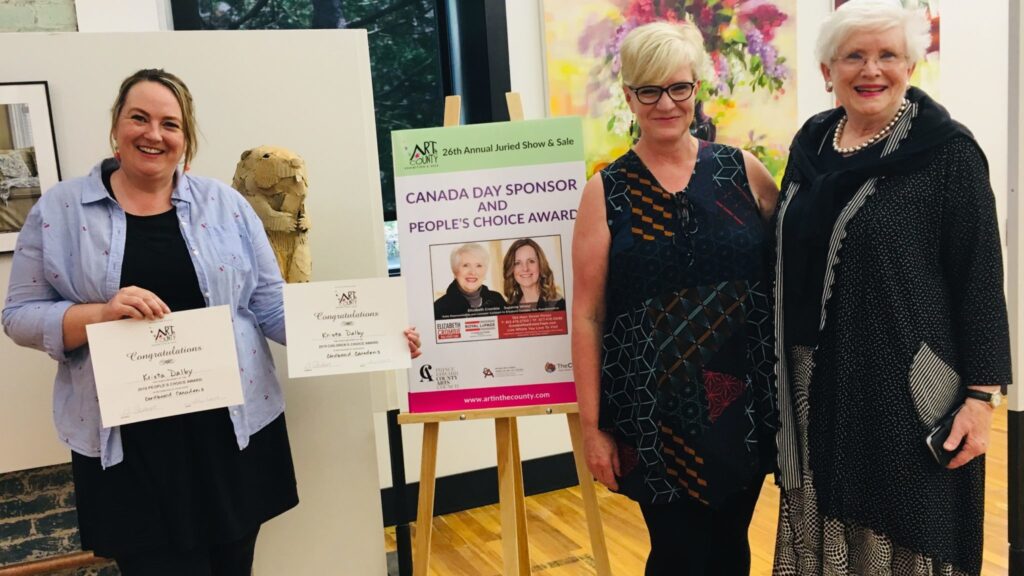 <p>BEST CHOICE- (From Left) Local Artsist Krista Dalby is presented the 2019 Art in The County People’s and Children’s Choice Awards by AITC Show co-chair Amy Schubert and sponsor Libby Crombie. (Submitted Photo)</p>
