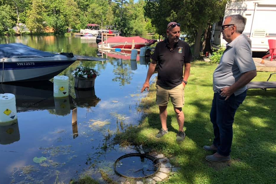 <p>THE TIDE IS HIGH- (From left) Log Cabin Point Resort owner/operator and Athol Councillor Jamie Forrester speaks with then-Bay of Quinte MP Neil Ellis in   2019. (Submitted Photo)</p>
