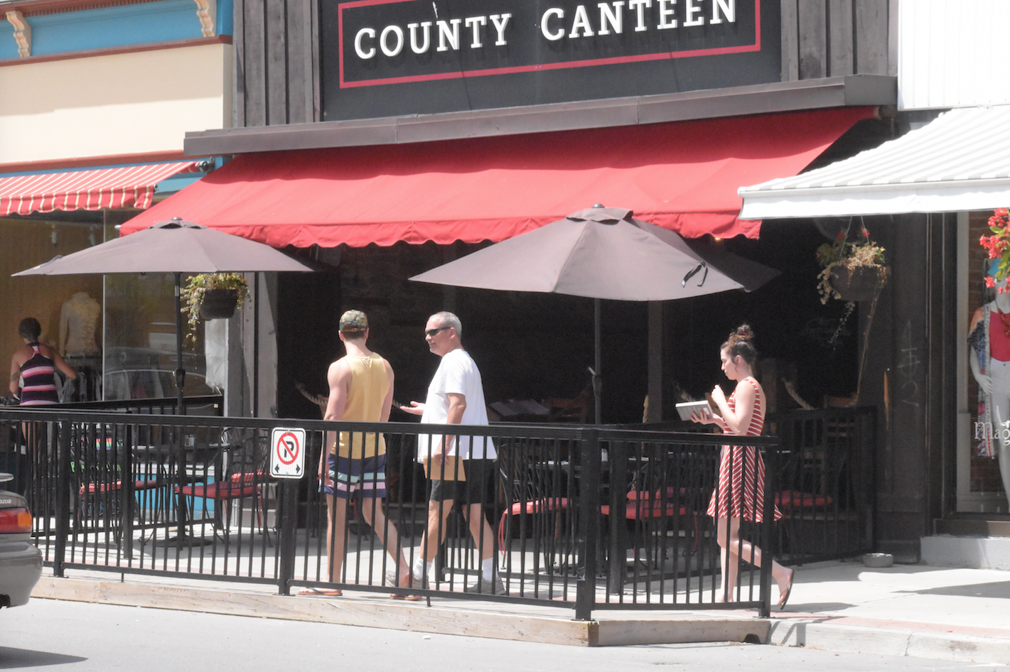 <p>HAPPY TRAILS TO YOU- Pedestrians travel along the sidewalk in front of the County Canteen on Main St. on Monday afternoon. (Jason Parks/Gazette Staff)</p>
