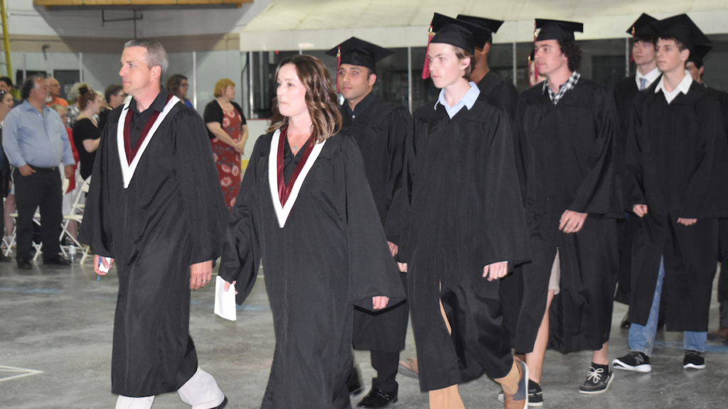 <p>THE PROCESSIONAL- PECI Staff members Andrew Holmes and Heather Monroe lead the graduating class of 2019 to their floor of the Prince Edward Community Centre on Thursday evening. (Sarah William/Gazette Staff)</p>
