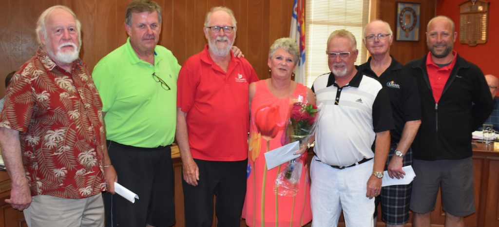 <p>COUNTY CLERK CELEBRATED (Fourth from right) Retiring County clerk Kim White was presented flowers and gifts from former councillors Barry Turpin, Kevin Gale, Gord Fox, former Mayor Robert Quaiff, Jim Dunlop and Steve Graham at the June 25 council meeting. White retired after 30 years with the municipality. (Jason Parks/Gazette Staff)</p>
