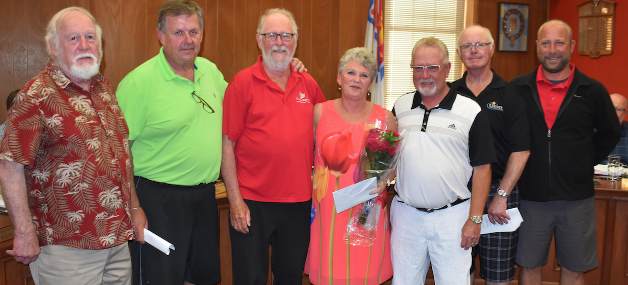 <p>COUNTY CLERK CELEBRATED (Fourth from right) Retiring County clerk Kim White was presented flowers and gifts from former councillors Barry Turpin, Kevin Gale, Gord Fox, former Mayor Robert Quaiff, Jim Dunlop and Steve Graham at the June 25 council meeting. White retired after 30 years with the municipality. (Jason Parks/Gazette Staff)</p>
