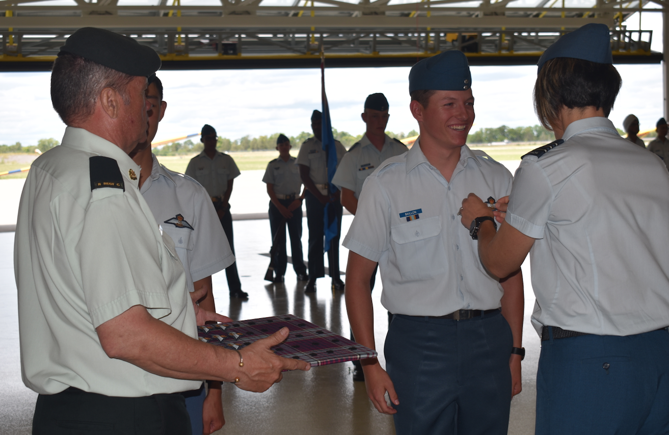 <p>UP AND AWAY – Cadet Owen Baillon receives his wings from LCol Baldasaro. (Sarah Williams/Gazette Staff)</p>

