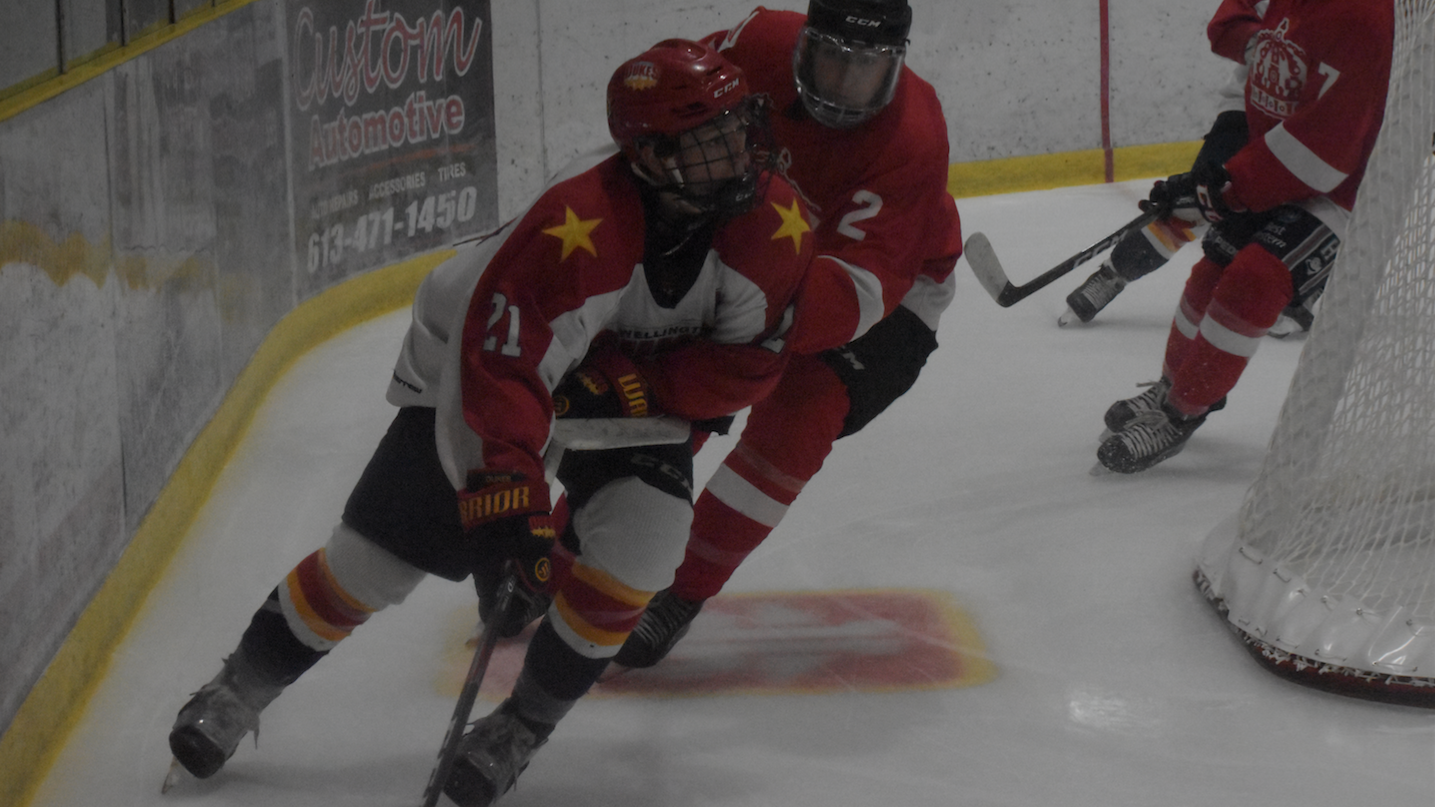 <p>TIMBER- Wellington Duke Dawson Ellis withstands some chopping by Pembroke Lumber King Sean Fourtier during Wellington&#8217;s 5-1 preseason loss Wednesday night at LeHigh Arena. (Jason Parks/Gazette Staff)</p>
