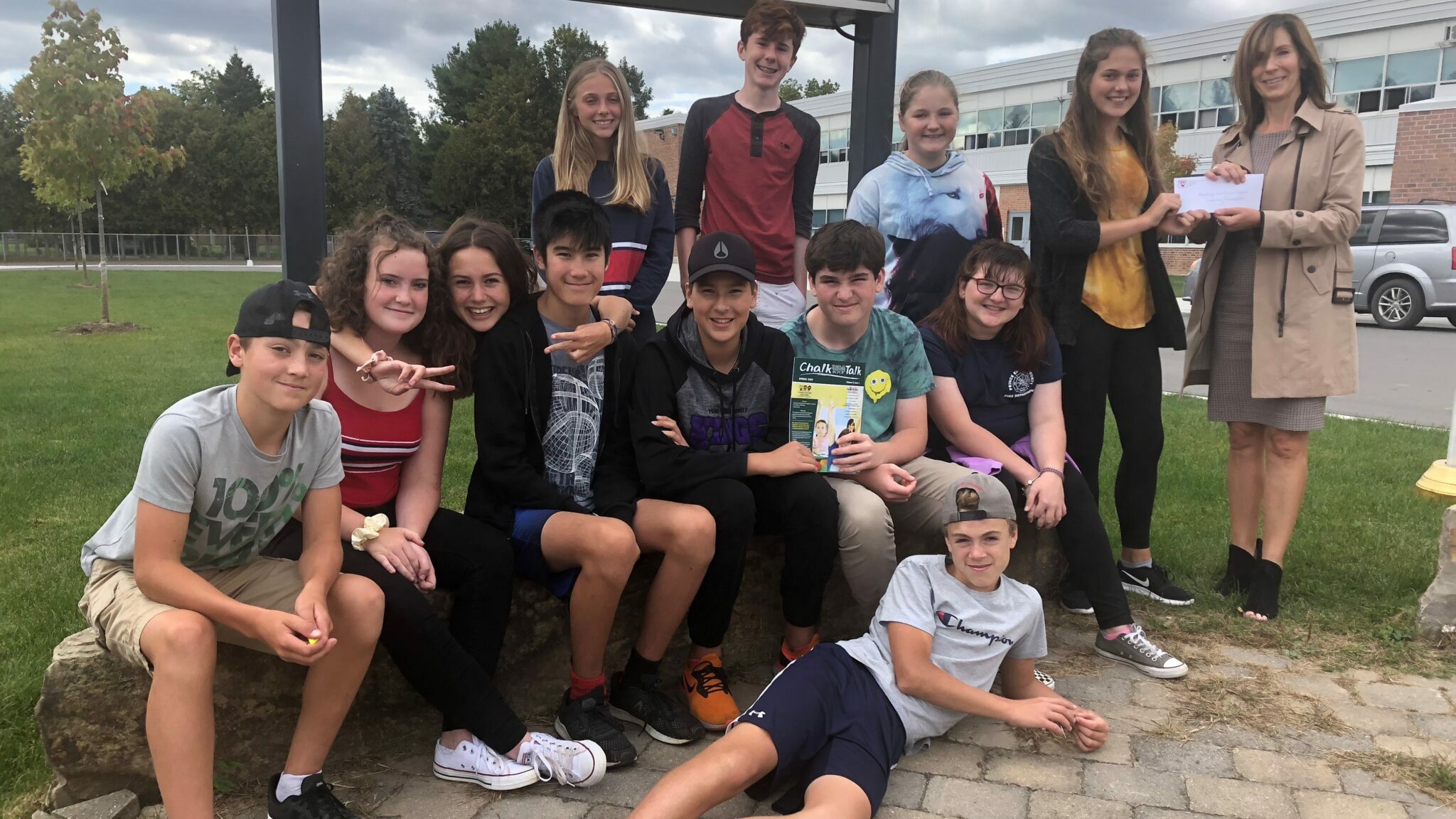 <p>COMMUNAL DONATION- Students in PECI&#8217;s Venture Enrichment Program present $904 to Hastings and Prince Edward Learning Foundation Executive Director Maribeth deSnoo. (Jason Parks/Gazette Staff)</p>

