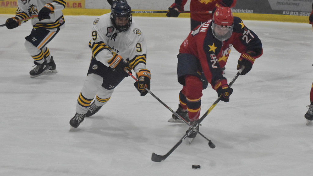 <p>WINNING BATTLE- Dukes forward Jake Gagnon fights off Whitby Fury defender Daniel Ebrahim during Wellington’s 5-2 win at Lehigh Arena Friday night. (Jason Parks/Gazette Staff)</p>
