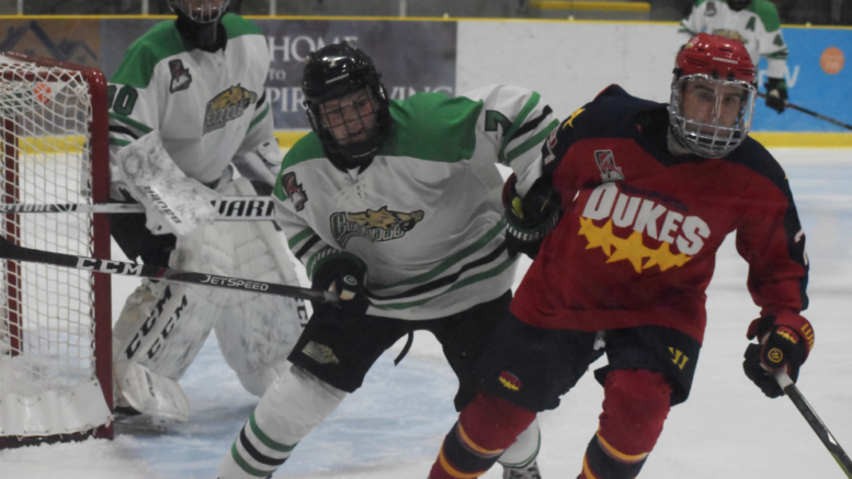 <p>NO HOLDING BACK- Dukes forward Jake Gagnon muscles through Cobourg’s Darren Beattie during Wellington’s 5-2 win at Lehigh Arena Friday night. Gagnon leads Wellington in scoring with eight points in four games. (Jason Parks/Gazette Staff)</p>

