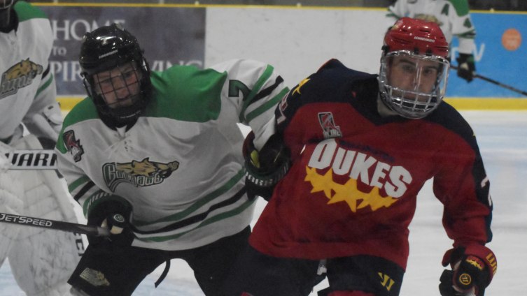 <p>NO HOLDING BACK- Dukes forward Jake Gagnon muscles through Cobourg’s Darren Beattie during Wellington’s 5-2 win at Lehigh Arena Friday night. Gagnon leads Wellington in scoring with eight points in four games. (Jason Parks/Gazette Staff)</p>
