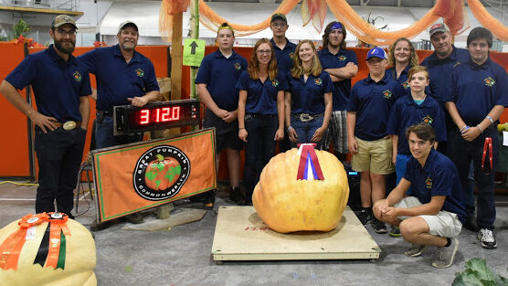 <p>ORANGE GIANT The 4-H Giant Vegetable Club seen at the 2019 Picton Fair with their efforts which included a 688 lbs pumpkin.  (submitted photo)</p>
