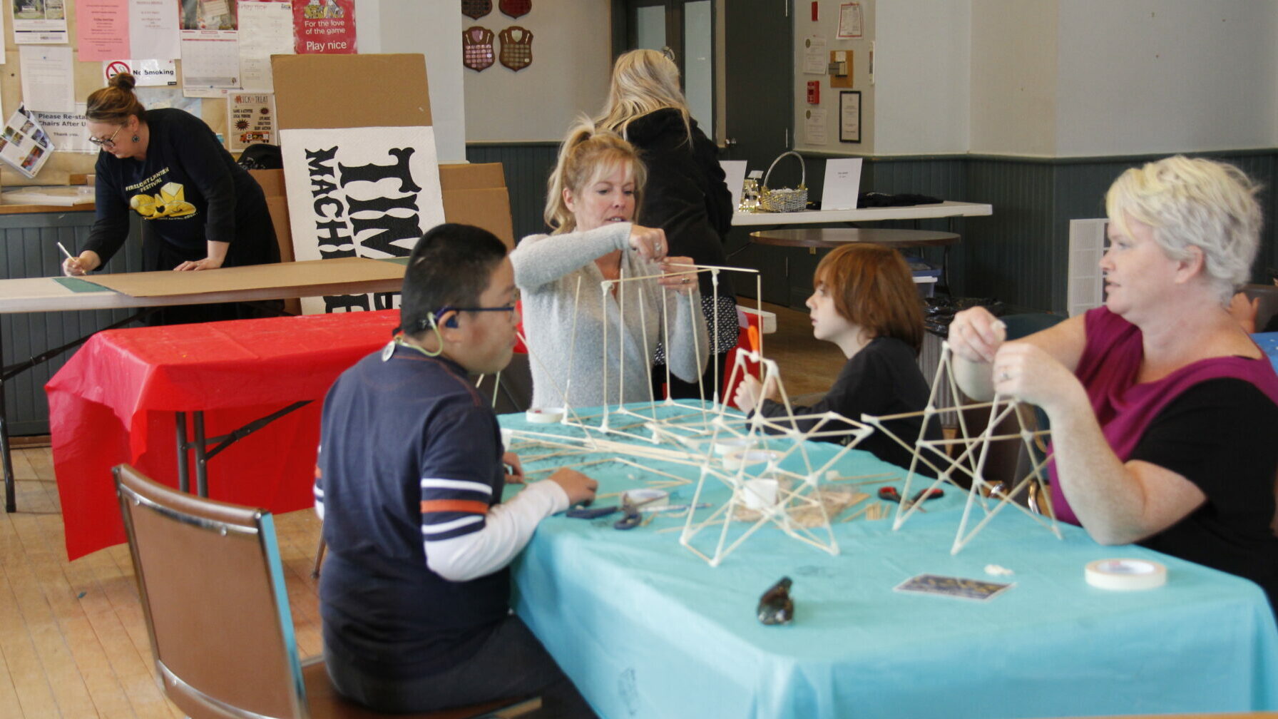<p>IN THE ZONE (back left) Krista Dalby works on a sign for the Firelight Lantern Festival at a free workshop while (front left) Shannon Kleist and (front right) Tina Mcewen from Community Living Belleville helped make lanterns with the children at Picton Town Hall earlier this month. The Firelight Lantern Festival is Nov. 9, starting at Benson Park at 6 p.m. (Desirée Decoste/Gazette Staff) </p>

