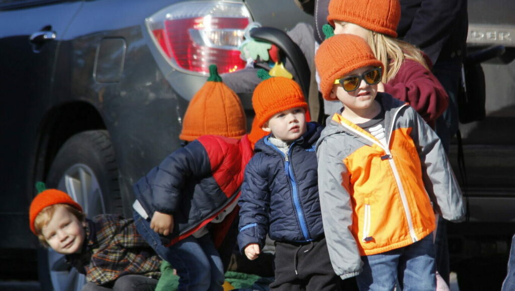 <p>PUMPKIN HEADS A group of children with festive green stemmed hats watch the Wellington Pumpkinfest parade as it travels down Main St. Saturday . The festival had upwards of 1,500 people attend with some in the crowd visiting from as far as Nevada. (Desirée Decoste/Gazette Staff)</p>
