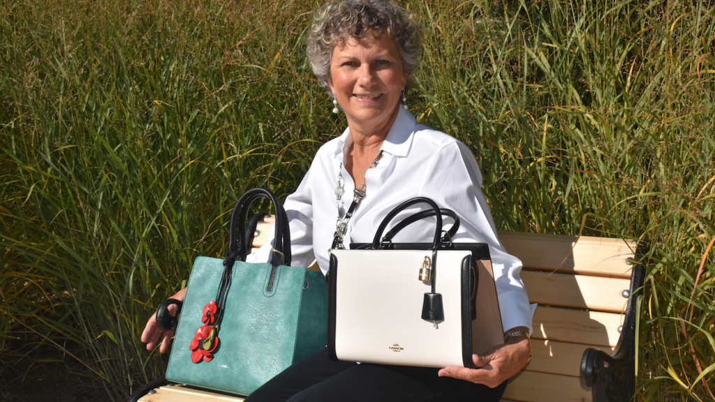 <p>Hospice Prince Edward’s Ingrid Davis shows off just a couple of the handbags that will be auctioned off at the ‘Handbags for Hospice’ event Wed., Nov 6 at the Highline Hall. (Jason Parks/Gazette Staff)</p>
