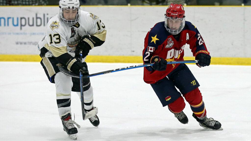 <p>ON POINT- Ben Woodhouse of the Wellington Dukes battles for position with Ryan Brown of the Trenton Golden Hawks during Wellington’s 4-3 overtime win Sunday at Lehigh Arena. (Ed McPherson / OJHL Images)</p>
