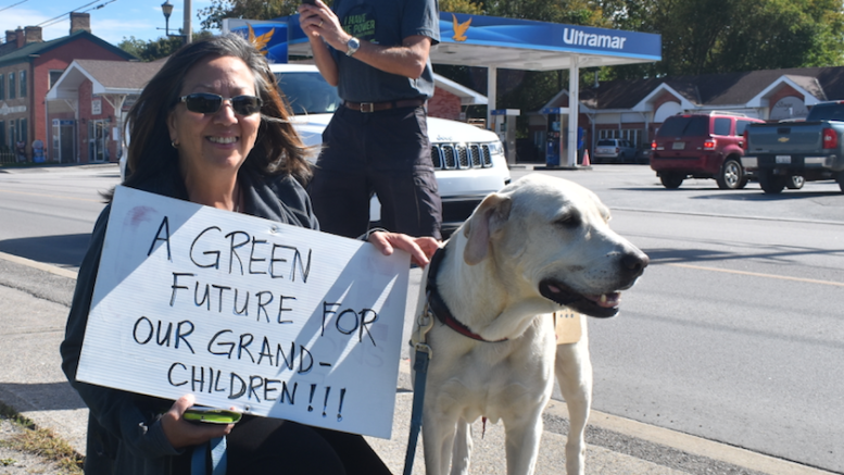 <p>ALL CREATURES GREAT AND SMALL – Eileen Manpili and her dog, Diego, joined the protest on Friday to draw awareness to the effects of climate change. (Sarah Williams/Gazette Staff)</p>
